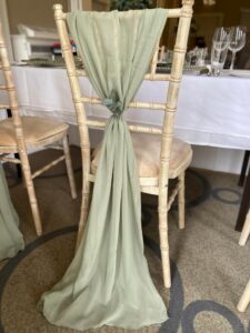 limewash chair with green drape